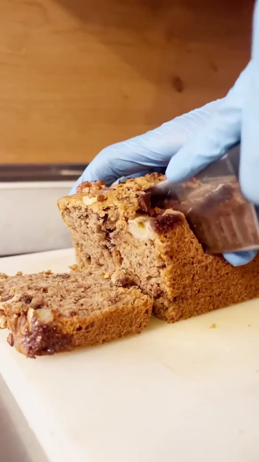 A cake being sliced in the Pinturicchio kitchen.